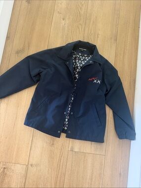 Uniqlo x KAWS Navy Coach Jacket with Red Embroidered Detail